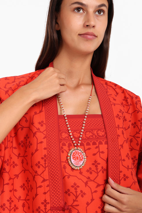 Short jacket in printed cotton with one front button and side slits